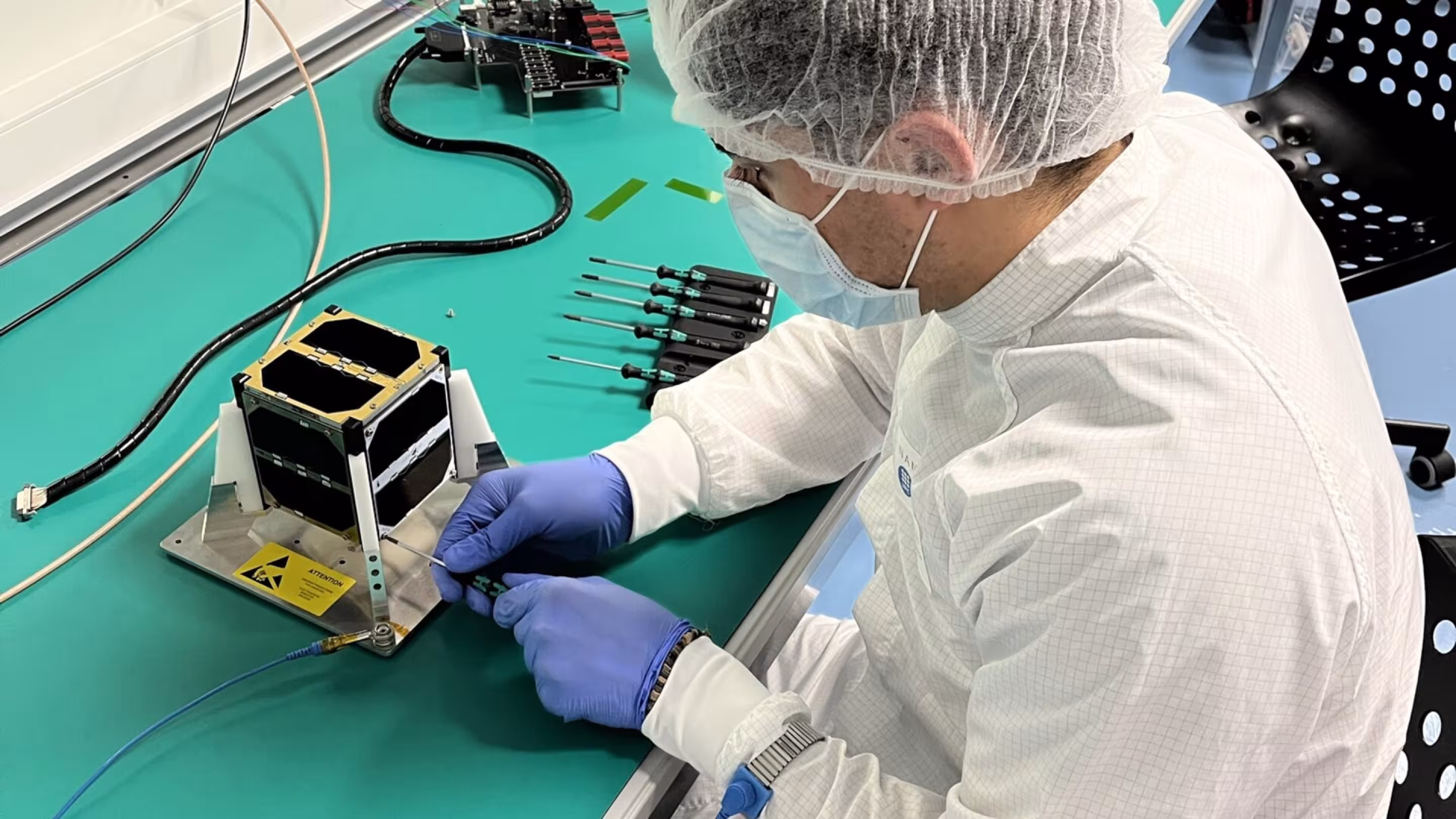 Student working on CubeSat Satellite. Picture by European Space Agency ESA. 